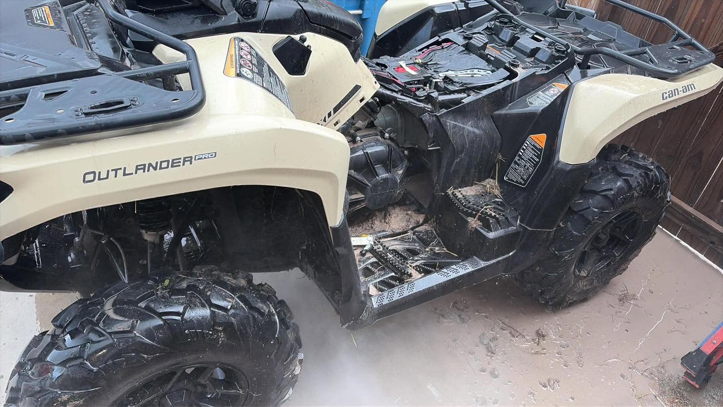 Can-Am Outlander covered in dried mud and straw after a weekend of riding
